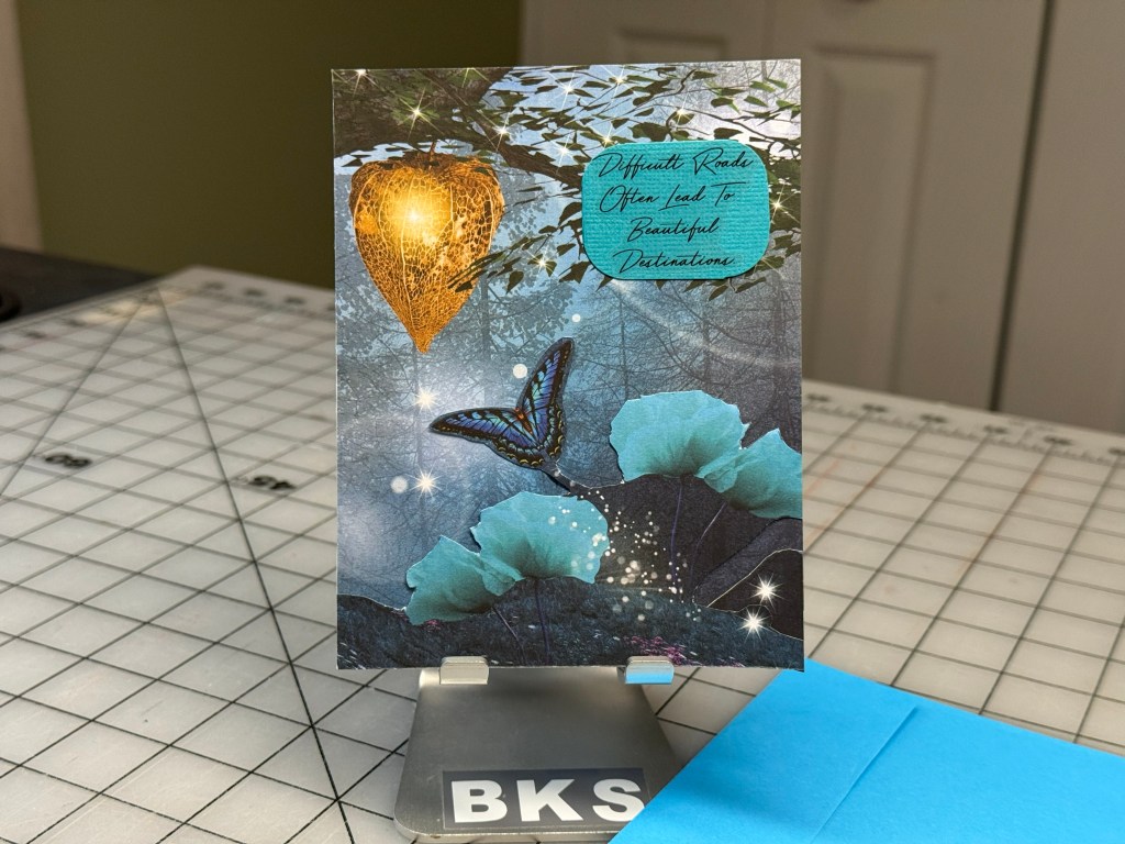 Handmade fantasy card featuring a glowing lantern and butterfly with an inspirational quote in a twilight woodland scene